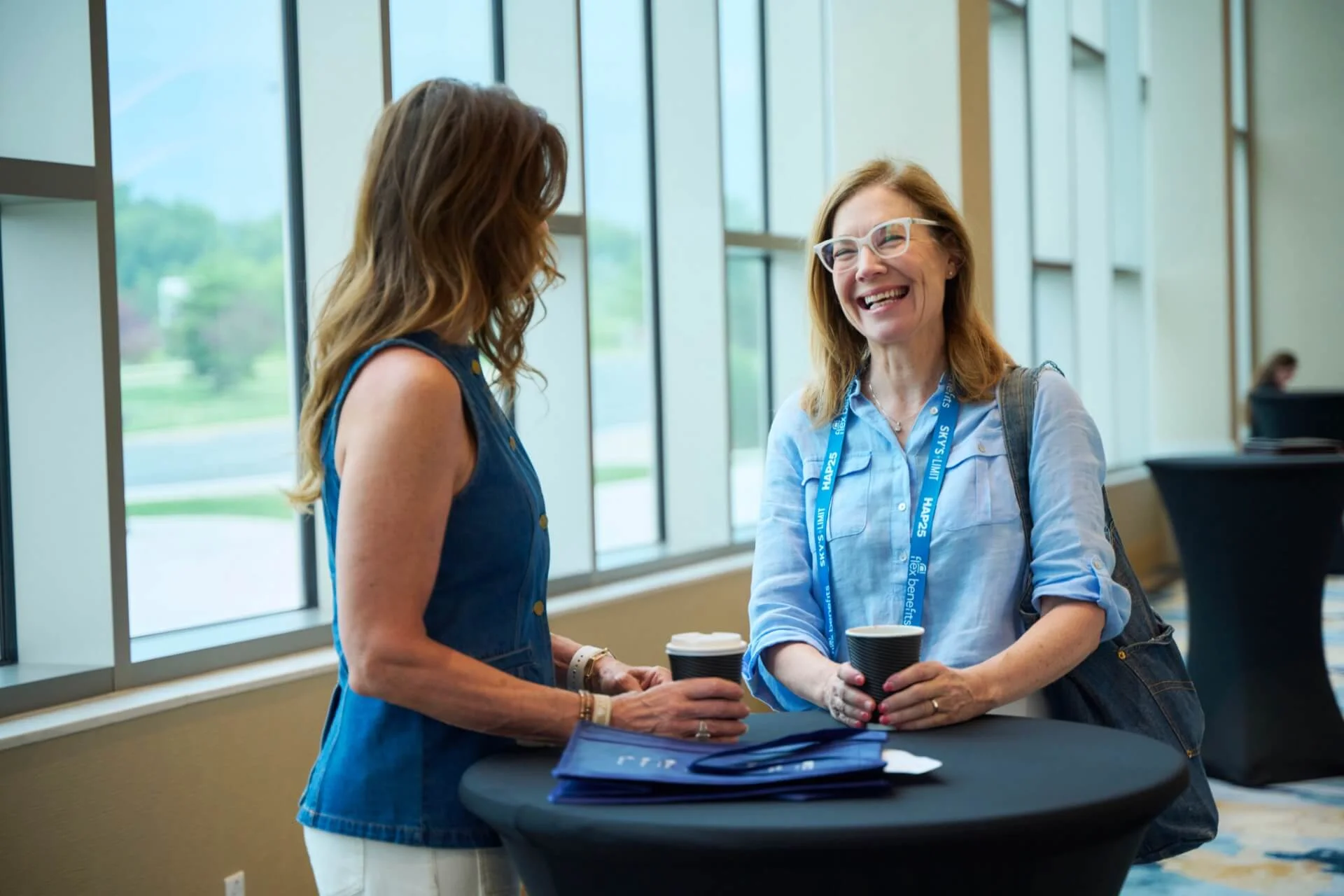 Support services — agent smiling at conference